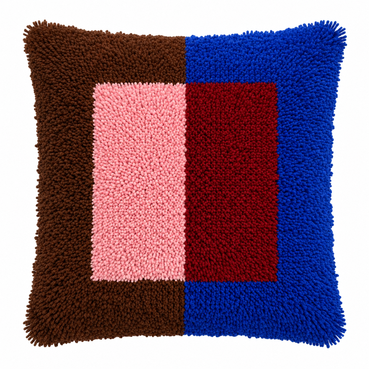 A square shaggy latch hook throw pillow with a geometric color-block pattern featuring brown, pink, red, and blue sections.